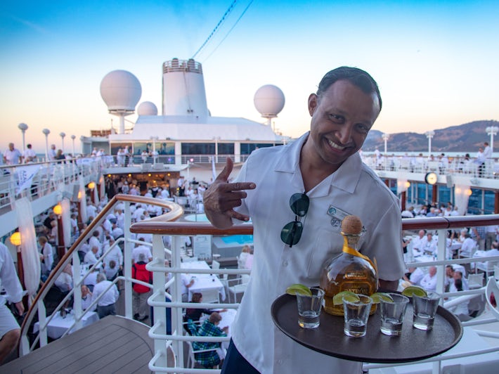 Waiter with tequila at White Party on Azamara Club Cruises (Photo: Tim Faircloth)