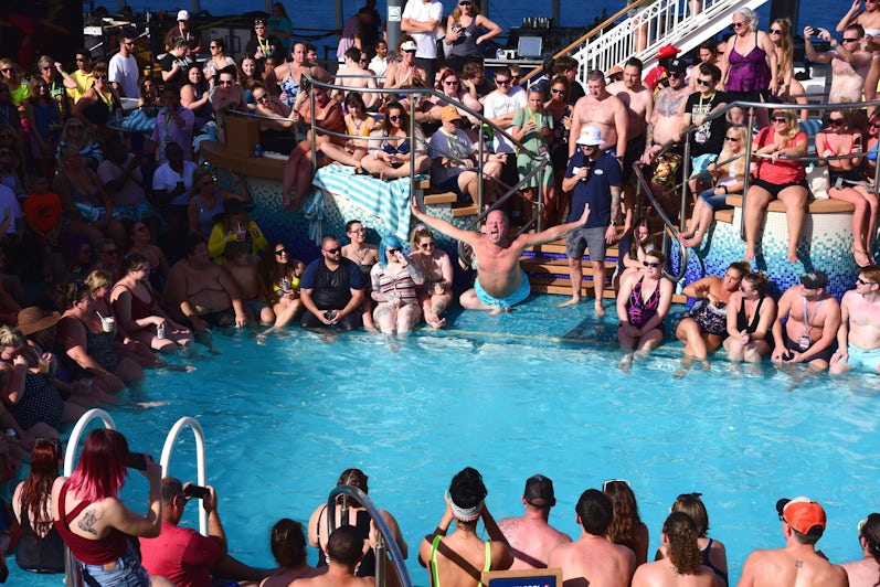 Man in mid-air during Belly flop competition on Impractical Jokers Cruise 4
