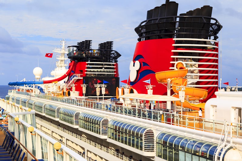 Cropped side-view of Disney Magic's upper decks and funnels