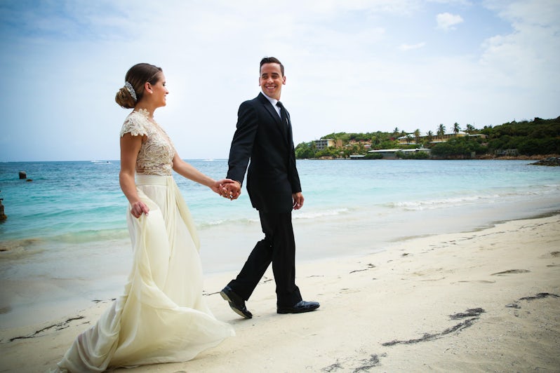 Married Couple Walking Along Shoreline (Photo: Royal Caribbean International)