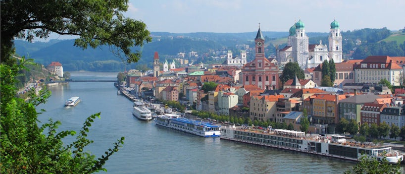 River cruise boats dock along the Danube River. (Photo: Peteri/Shutterstock)