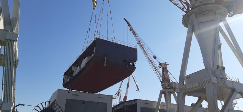 Explora II's hull being lowered into place at Fincantieri shipyard Genoa (Photo: Jeannine Williamson)