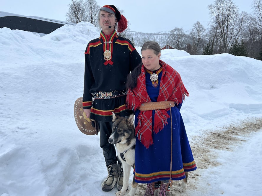 Sami hosts with Spirit, one of their 21 husky dogs. Photo: Harriet Baskas