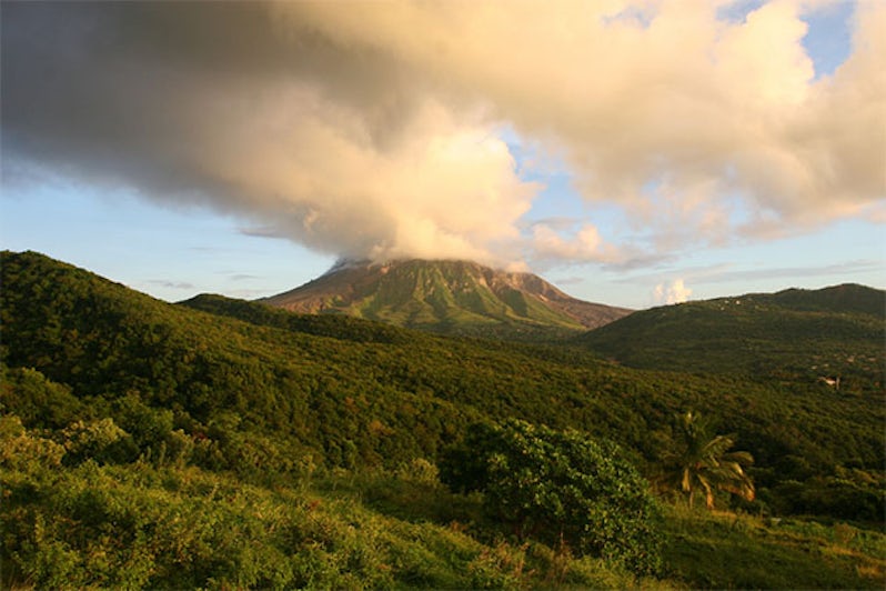 Mount Soufriere smoking volcano at sunset