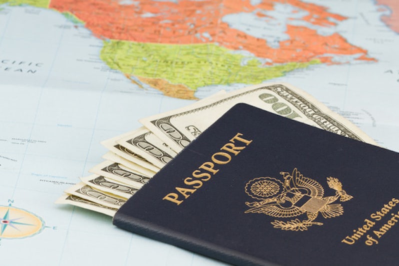  American passport with American currency and a map as a background