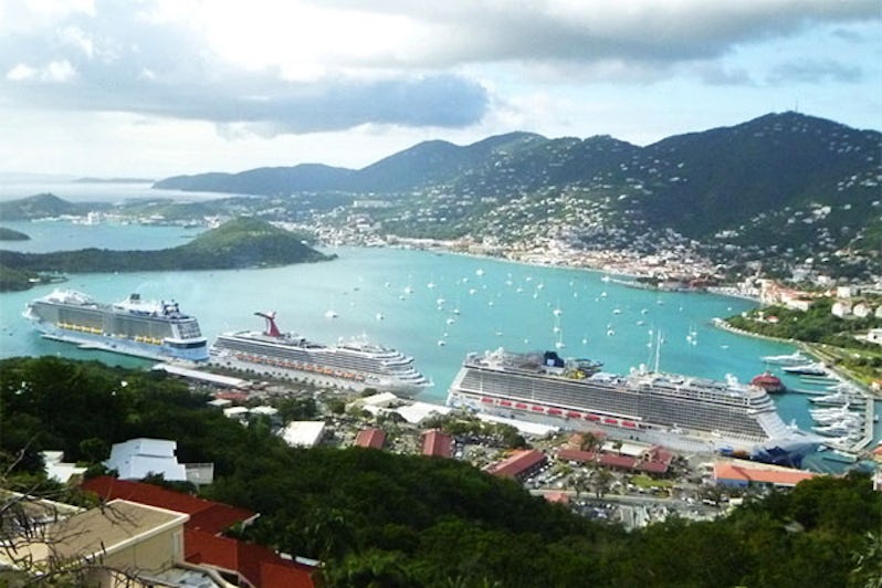 Anthem of the Seas docked at St. Thomas along a Carnival and Norwegian cruise ship.