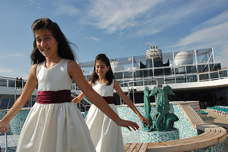 Two girls in pretty dressed on a Crystal Cruises sun deck