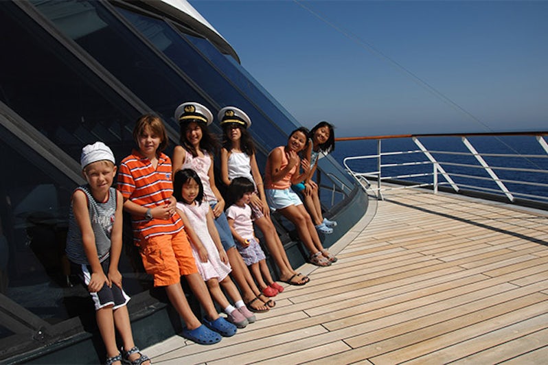 Group of kids lined up on a Crystal Cruises ship