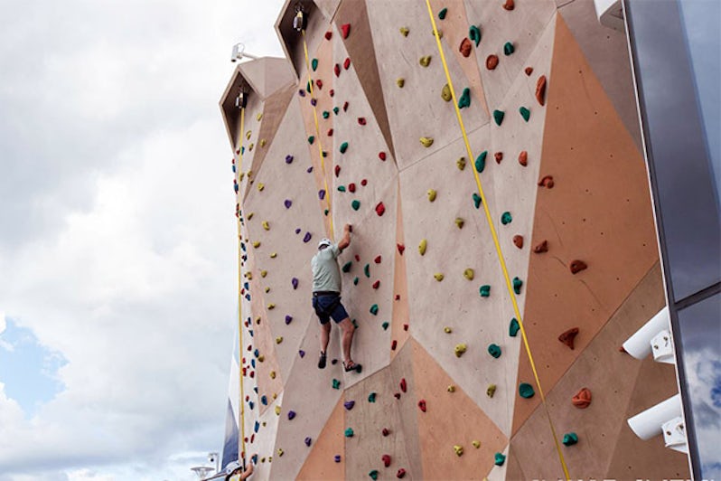 Passengers on Anthem's rock climbing wall