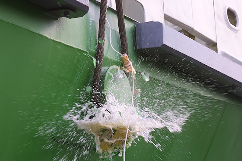 Champagne smashed against the bow of a ship