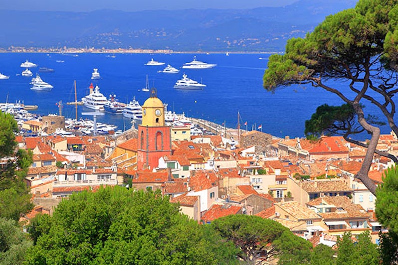 Aerial view to the old town and distant boats, Saint Tropez, French Riviera, France