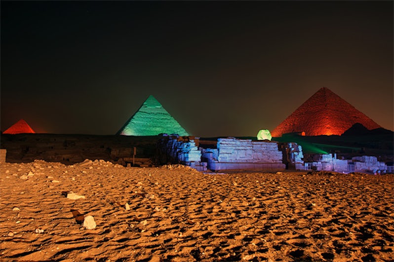 Giza pyramid and Sphinx light up for sound and light show, Cairo, Egypt.