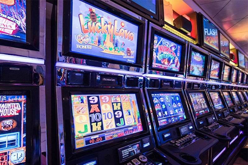 Row of slot machines at Breakaway Casino on Norwegian Breakaway
