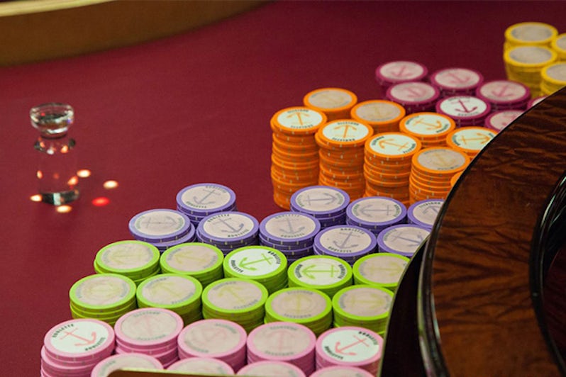 Close up shot of chips at the Winner's Luck Casino on Carnival Breeze