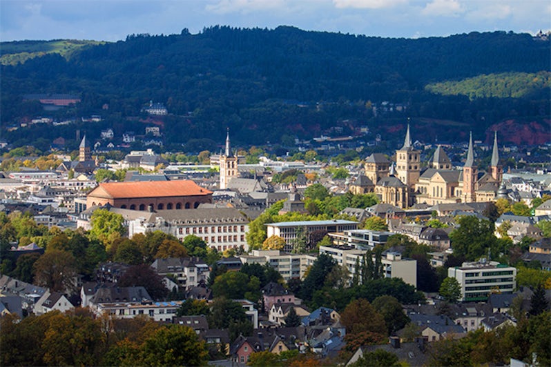 Aerial shot of several Medieval monuments (Cathedral of Saint Peter, Basilica of Constantine, St. Gangolf church and others) in Trier, Germany