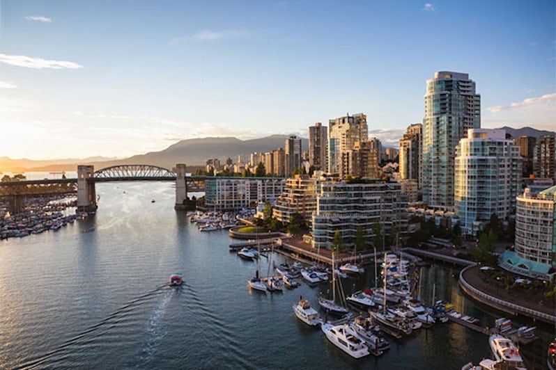 View of Downtown Vancouver and Burrard Bridge at False Creek during sunny sunset
