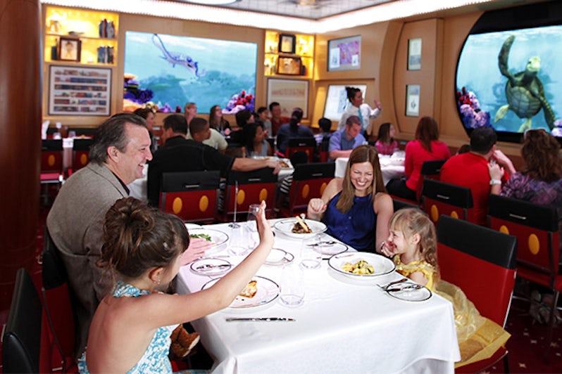 Family with young children dining at Animator's Palate on the Disney Fantasy and Disney Dream