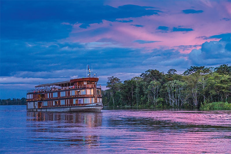 Delfin II on the Amazon River at sunset