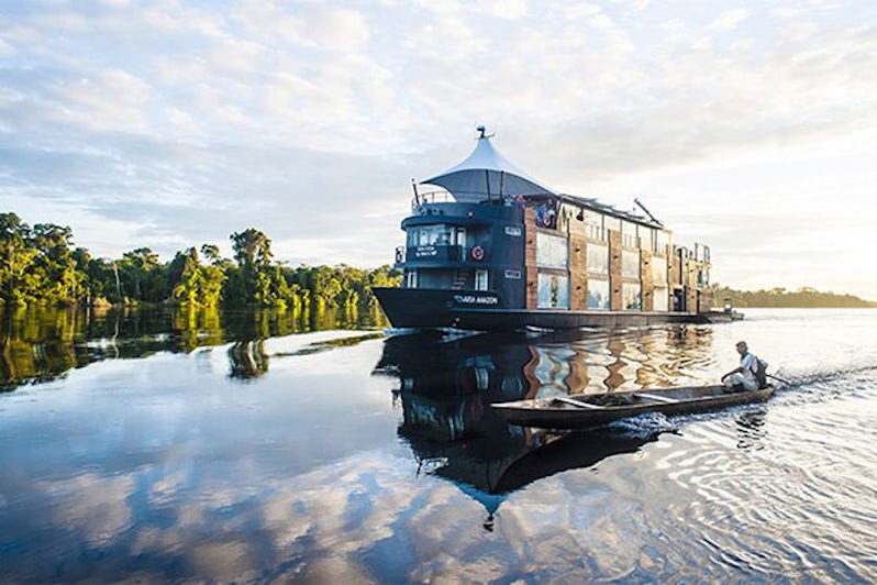 Exterior shot of Aria Amazon on the Amazon River at sunset