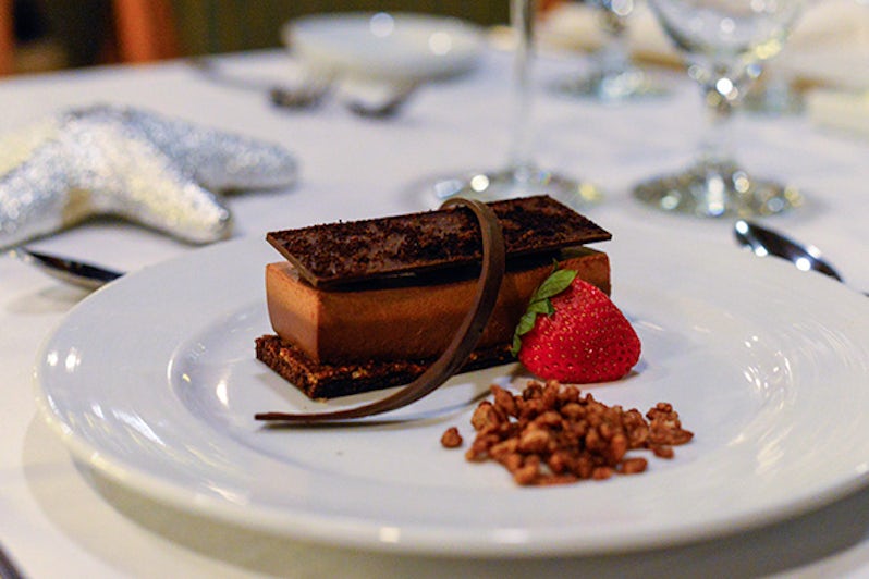 Close-up shot of a chocolate dessert in the Wind Star Dining Room on Carnival Ecstasy