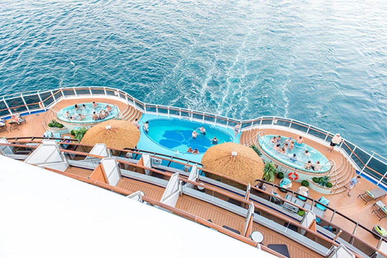 Aerial view of passengers enjoying the Havana Pool and hot tubs on Carnival Vista
