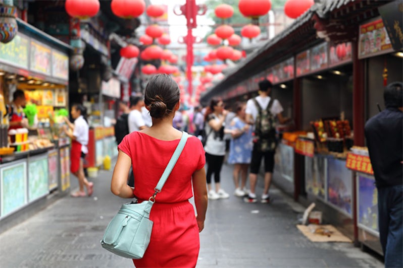 Woman wandering in Chinese food market