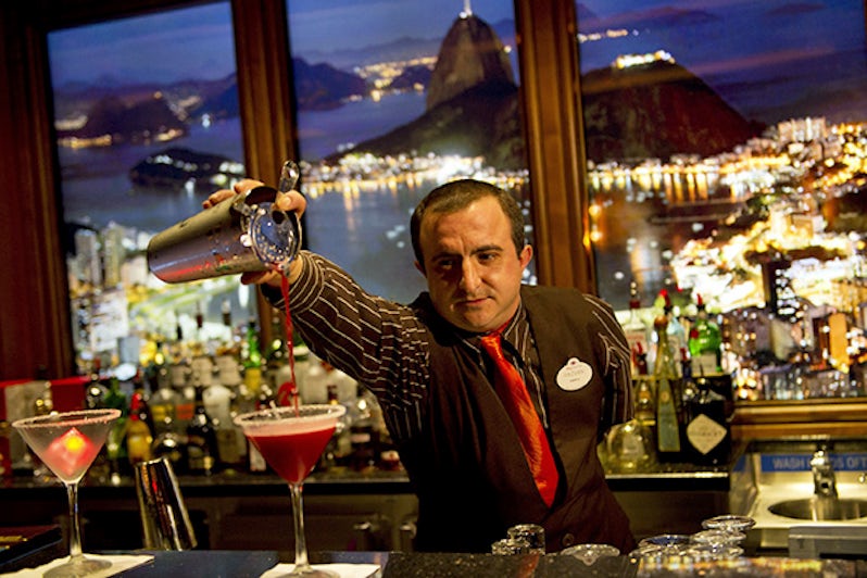 Skyline waiter pouring a cocktail onboard a Disney ship