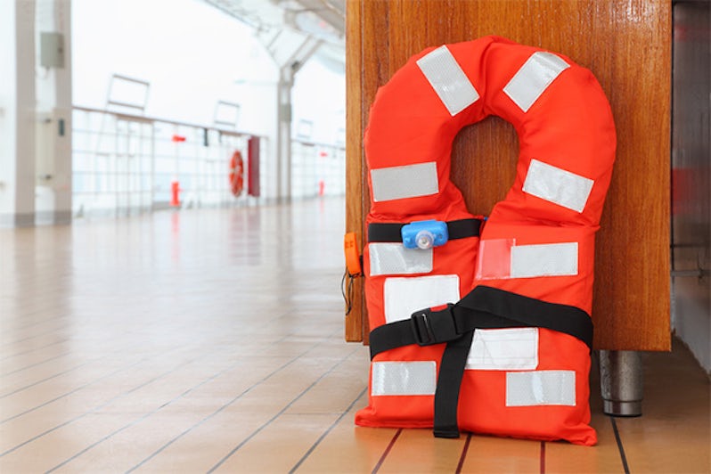 Close-up shot of an orange life jacket onboard a cruise ship