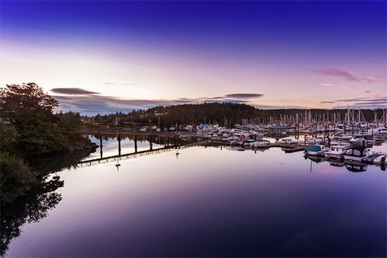 The waters in Friday Harbor's marina are still just after sunset in San Juan Islands, Washington
