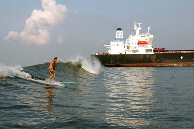 surfing the waves caused by tankers