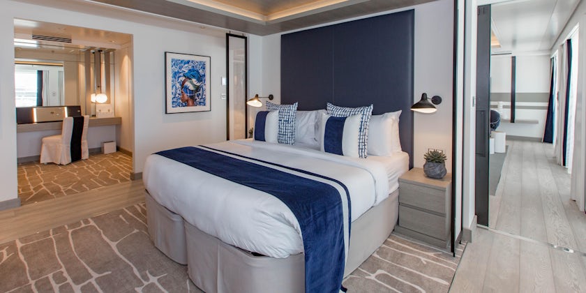 Photo of the blue and white bedroom area in Celebrity Edge's Penthouse Suite