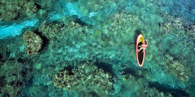 Paddle-Boarding in the Bahamas (Photo: Joe West/Shutterstock) 