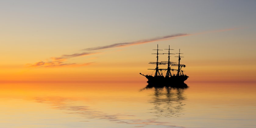 An abandoned ghost ship at sea (Photo: 23d/Shutterstock)