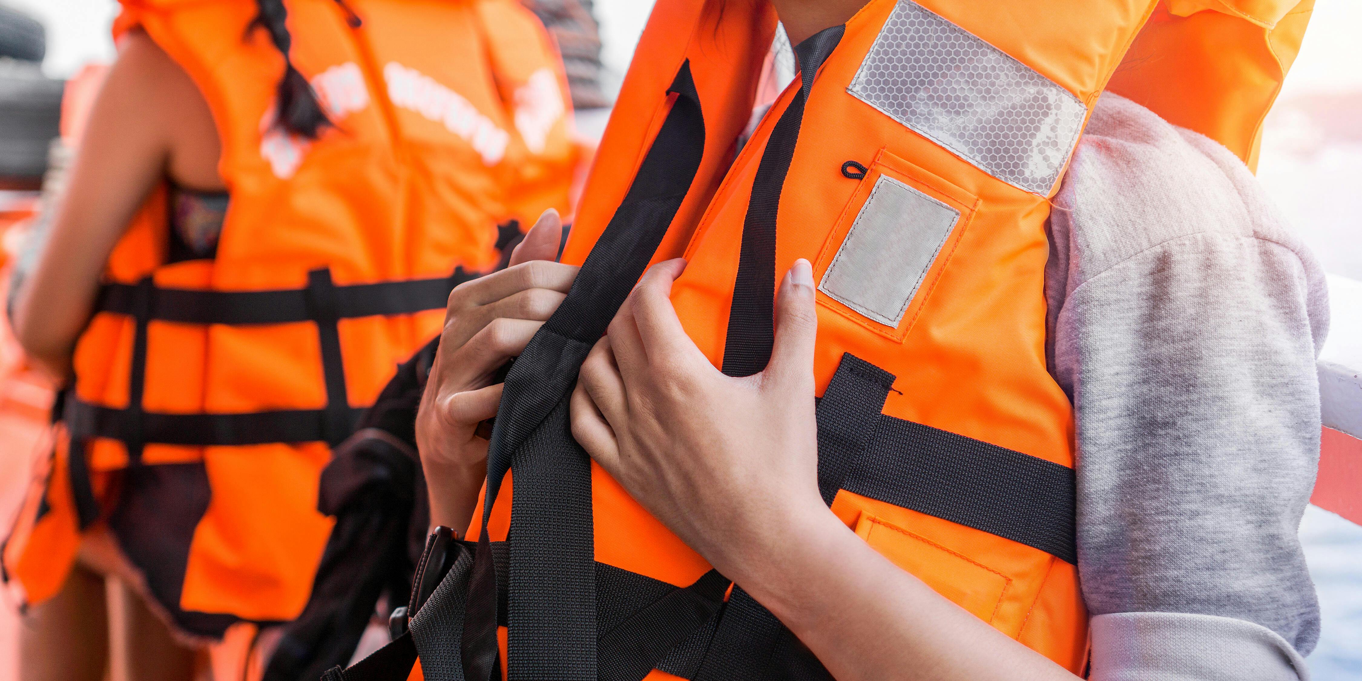 People Wearing Lifejackets (Photo: Chanintorn.v/Shutterstock)