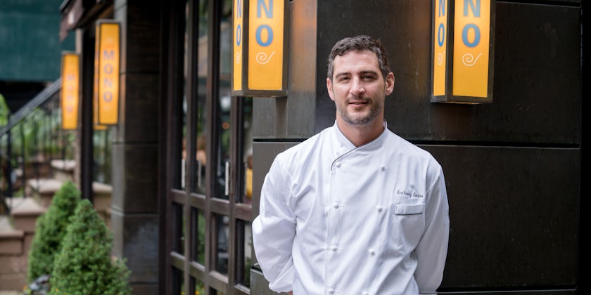 Portrait of Michelin-Starred chef Anthony Sasso in front of his on-land restaurant