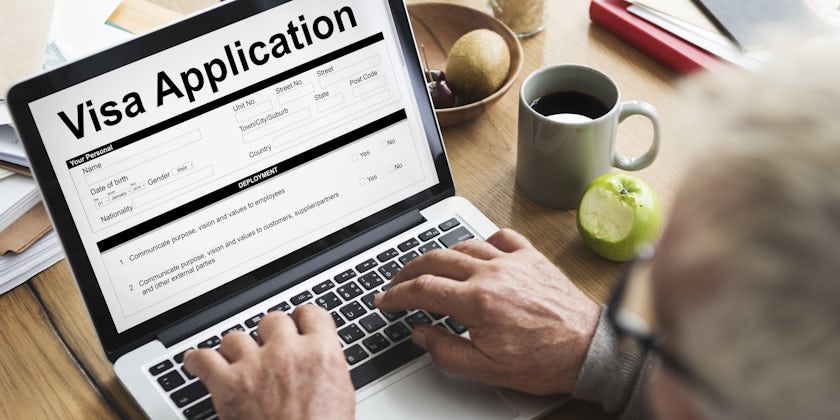 Man Filling out Online Visa Application (Photo: Rawpixel.com/Shutterstock)