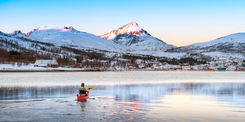 A Kayaker in Tromso, Norway, at Sunset (Photo: V. Belov/Shutterstock)