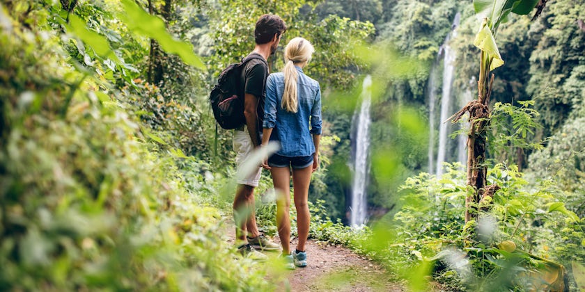 Couple Hiking in the Amazon, Overlooking Waterfall (Photo: Jacob Lund/Shutterstock)