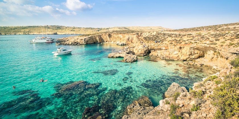 People Snorkeling in the Blue Lagoon in Comino Island, the Mediterranean Natural Wonder in the Beautiful Malta (Photo: View Apart/Shutterstock)