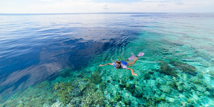 Woman Snorkeling Near Shallow Reefs in St. Maarten (Photo: Fabio Lamanna/Shutterstock)