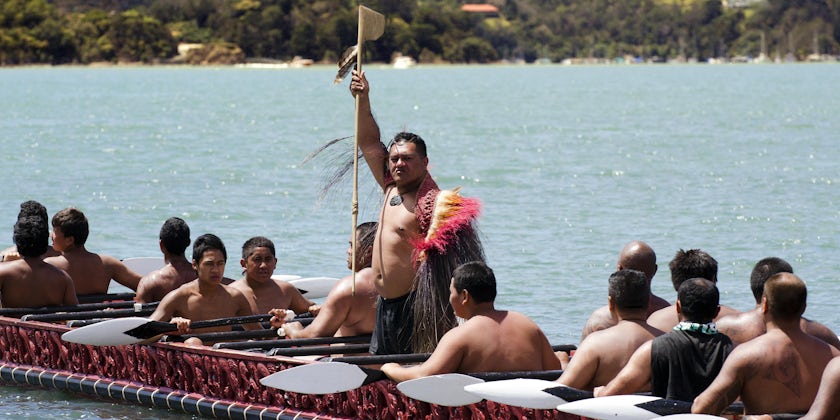 Maori Chief and Warriors row War Canoe During Waitangi Day (Photo: ChameleonsEye/Shutterstock)