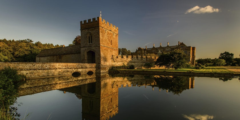 Moody exterior shot of the Broughton Castle at sunset