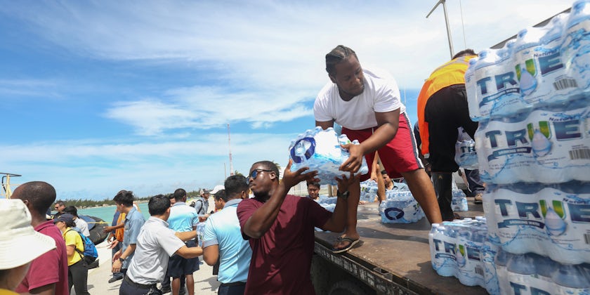 Royal Caribbean crew members unload relief supplies and meals for distribution at Grand Bahama (Photo: Royal Caribbean)