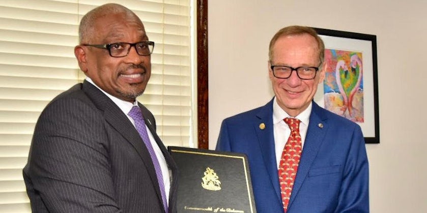 Dr. The Most Honorable Hubert A. Minnis, prime minister of The Commonwealth of The Bahamas standing next to Giora Israel, senior vice president of global port and destination development for Carnival Corporation (right)