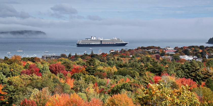 Holland America vessel cruising near fall foliage (Photo: Randall Vermillion/Shutterstock)