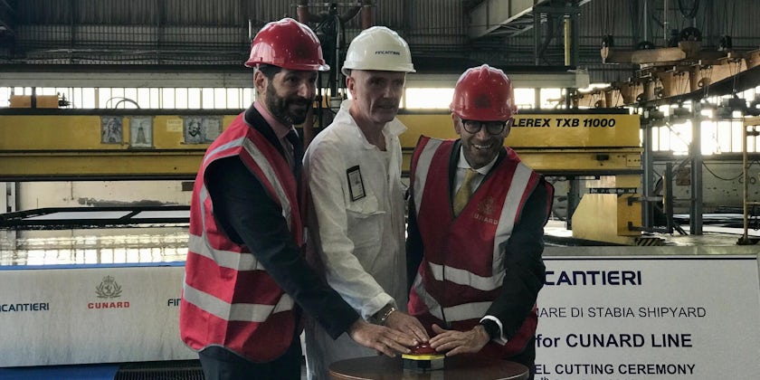 Carnival UK's Josh Weinstein, Fincantieri's Gilberto Tolbaldi and Cunard's Simon Palethorpe press the button to mark the start of the steel-cutting process