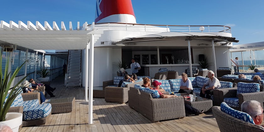 Passengers longing on the sun deck of Boudicca (Photo: Donna Dailey)
