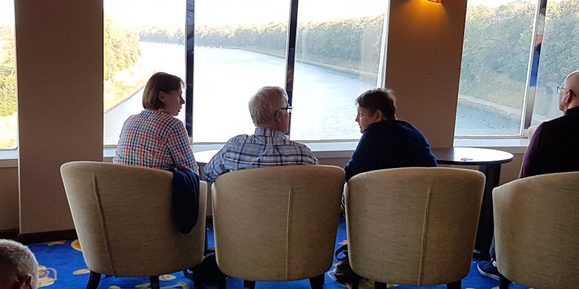 Passengers conversing in the Observatory Lounge on Fred. Olsen's Boudicca (Photo: Donna Dailey)