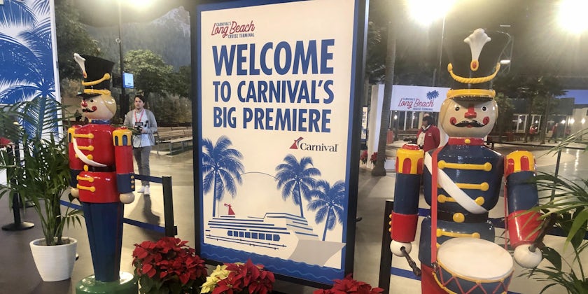 Carnival Panorama welcome sign, flanked by two life-size nutcrackers, at the Long Beach Cruise Terminal