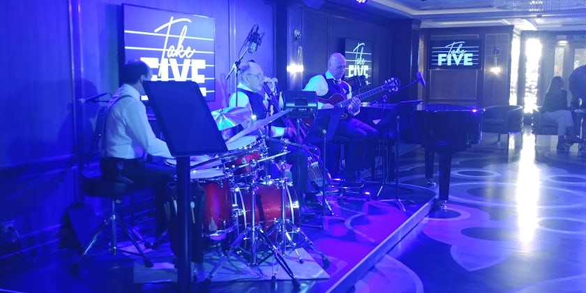The Take Five Lounge performance area at night, with performers onstage